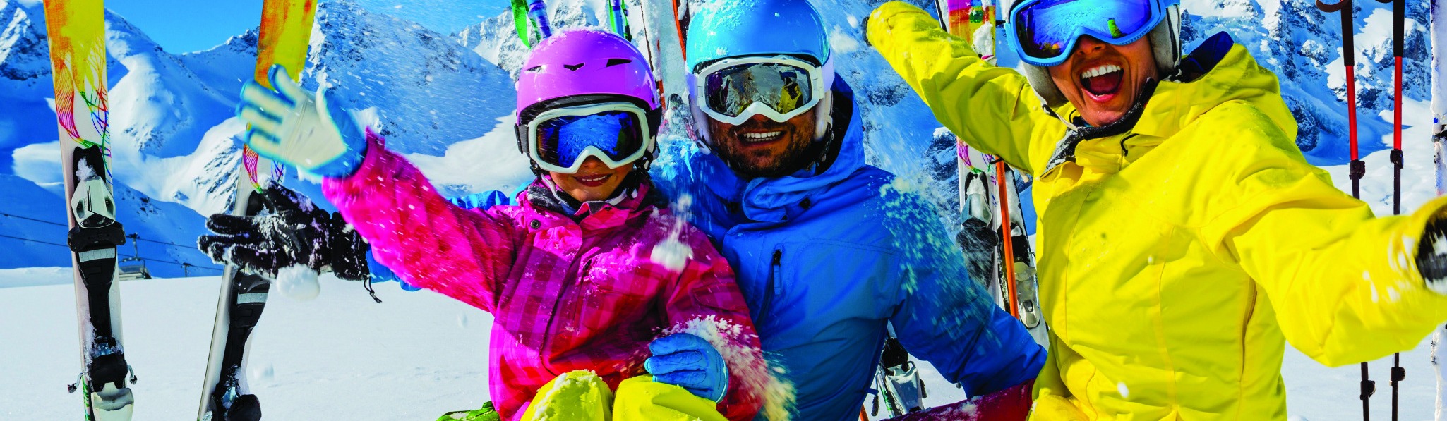 Skiiers relaxing on the slopes before skiing down the mountain