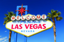 Welcome to Las Vegas sign with palm trees and blue skies